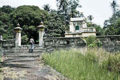 Man walking in front of building