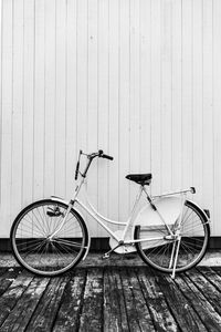 Vintage bike at the docks against a white wall