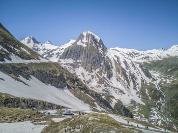 Scenic view of snowcapped mountains against clear sky