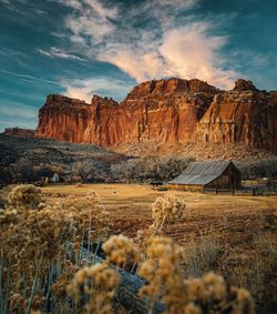 Rock formations on landscape against sky