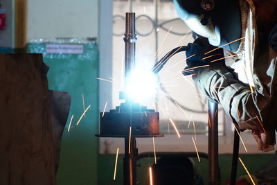 Man working in illuminated factory