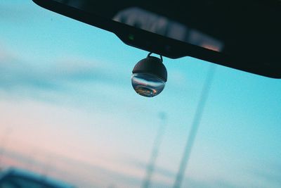 Low angle view of water drop against sky