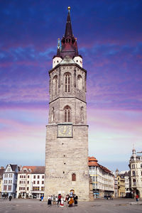 Clock tower of building in city