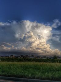 Scenic view of landscape against cloudy sky