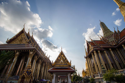 Low angle view of temple against cloudy sky