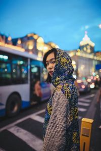 Woman standing in front of building