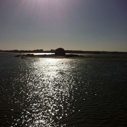 Scenic view of sea against sky at sunset