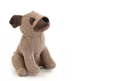 Close-up of stuffed toy over white background