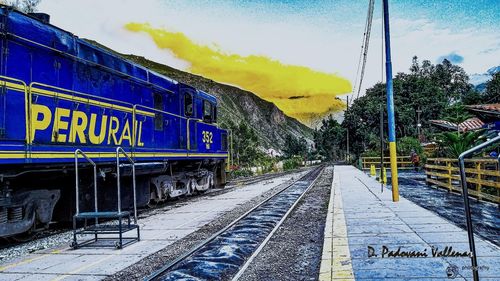 Train on railroad track against sky