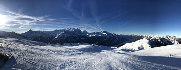 Scenic view of snowcapped mountains against sky