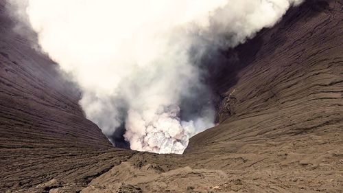 Smoke emitting from volcanic mountain