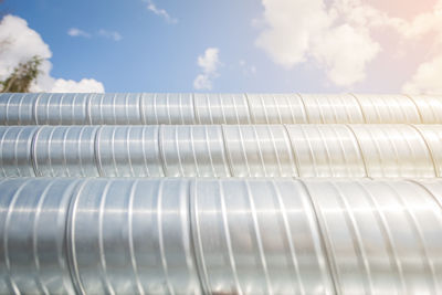 Ventilation pipes against the blue sky. steel pipes, parts for the construction of air ducts for an