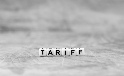 Close-up of information sign on table