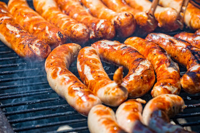 Close-up of bratwurst on barbecue grill