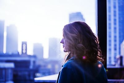 Woman looking at cityscape