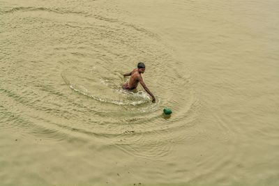 High angle view of man swimming in lake