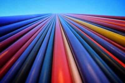 Close-up of multi colored pipes against sky
