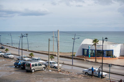 High angle view of road by sea against sky