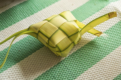 Coconut leaves weaved for making the ketupat, a traditional malay cuisine for the eid celebration.