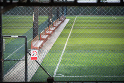 Information sign on chainlink fence