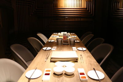 Chair and table arranged in restaurant