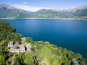 High angle view of townscape by sea against sky