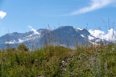 Scenic view of snowcapped mountains against sky