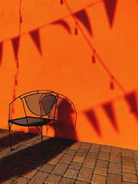 Shadow of basketball hoop on wall