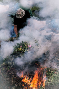 High angle view of woman by bonfire