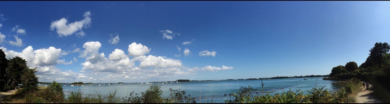 water, tranquil scene, tranquility, sky, scenics, blue, beauty in nature, lake, nature, sea, tree, idyllic, reflection, calm, outdoors, horizon over water, cloud, copy space, no people, day