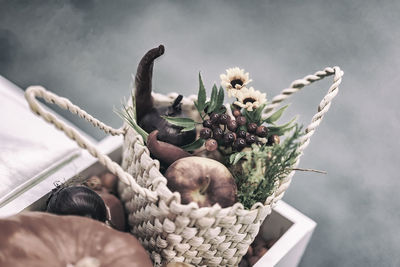 Close-up of man with fruits in basket