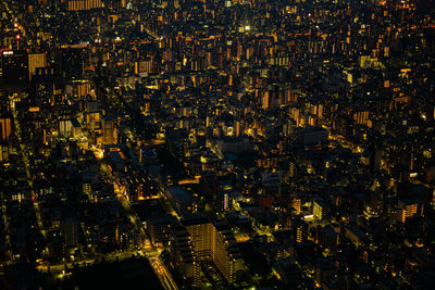 High angle view of illuminated cityscape at night