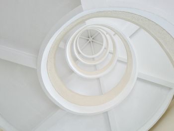 Low angle view of white spiral stairs