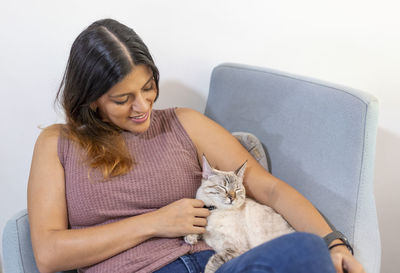 Young woman sitting at home