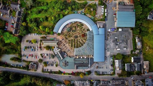 High angle view of buildings and trees in city
