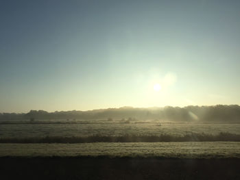 Scenic view of agricultural landscape against sky