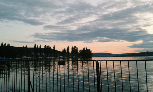 Scenic view of calm lake against sky