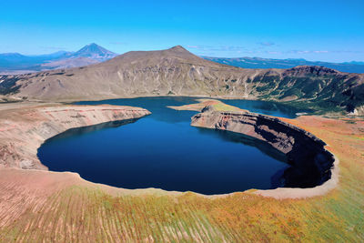 Scenic view of lake against blue sky