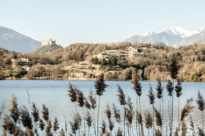 Scenic view of lake and mountains against clear sky