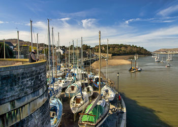 High angle view of sailboats moored at harbor