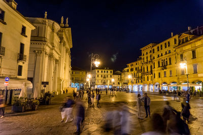 People on city street at night