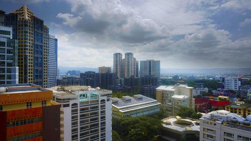 Modern buildings in city against sky