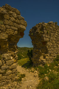 Rock formations on landscape against clear sky