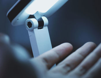 Close-up of human hand holding metal
