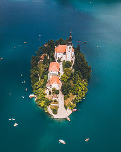 Aerial view of houses amidst sea
