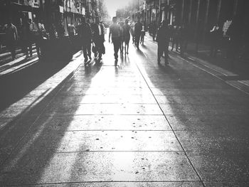 People walking on road in city