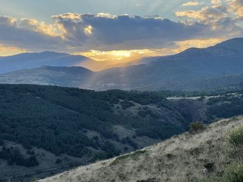 Scenic view of mountains against sky during sunset