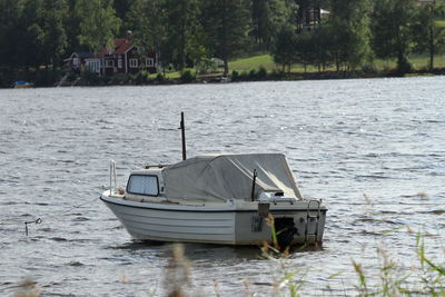 Boat moored on lake