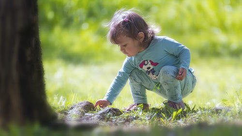 Woman standing on grass in park