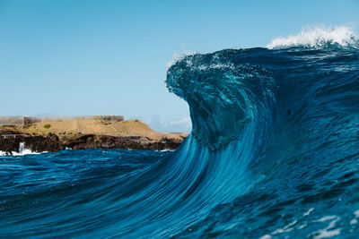 Scenic view of sea against clear blue sky